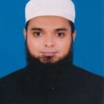 an image of a man wearing black colored panjabi and white prayer cap